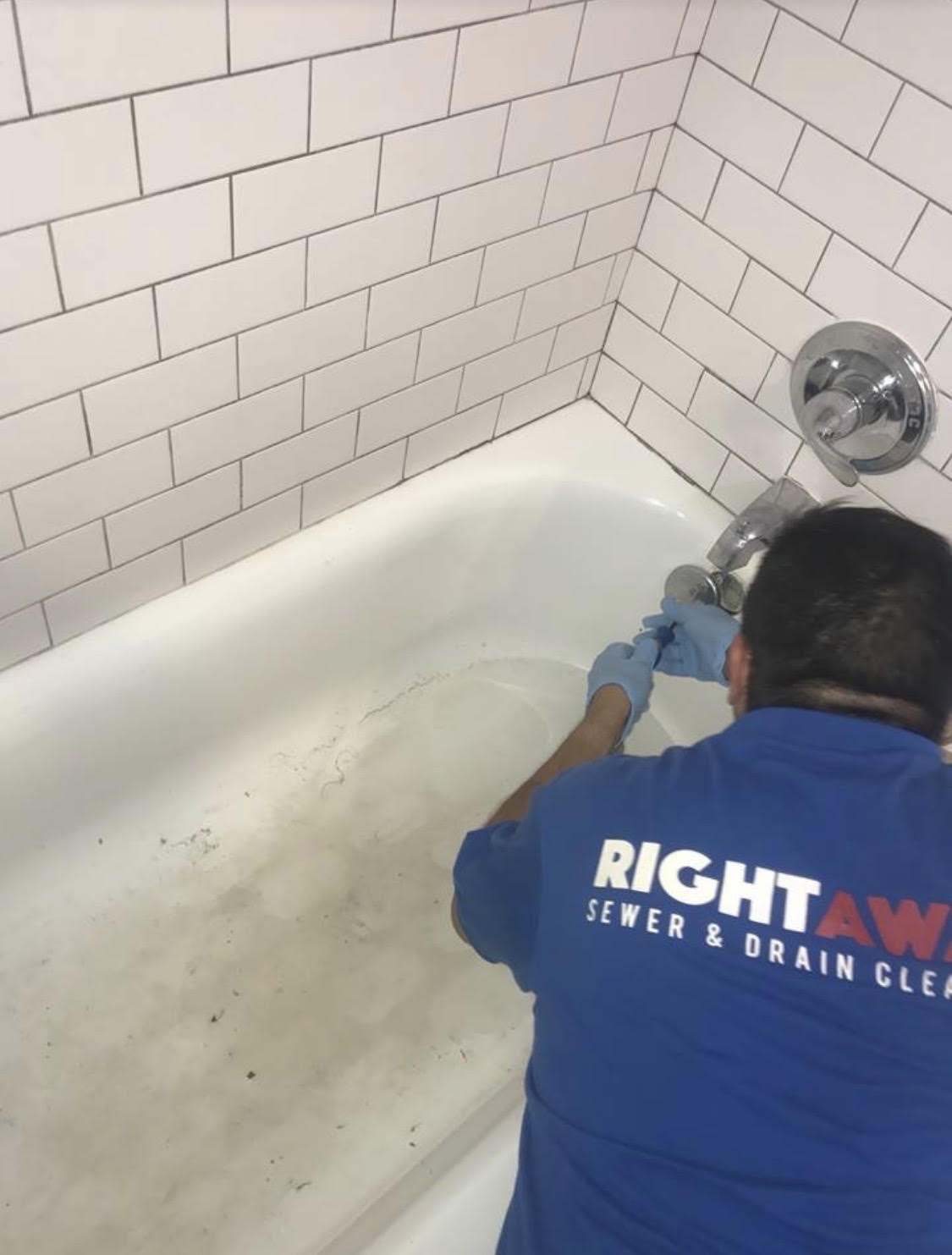 Right Away technician clearing a bathtub drain